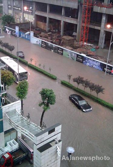 At least 27 die as rain, flood wreck S China