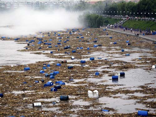 Chemical buckets washed into major river in NE China