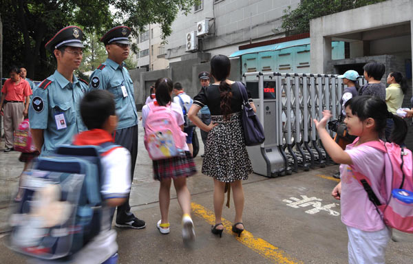 Kids go back to school under heavy security