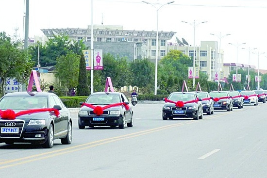 Proud villagers visit their town in 100 Audis