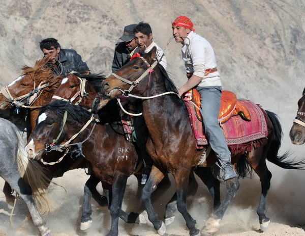 In Tajik wedding, herdsmen vie for the goat