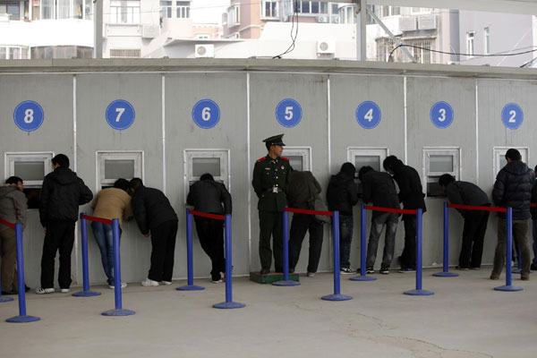 People queue up to buy tickets in Shanghai