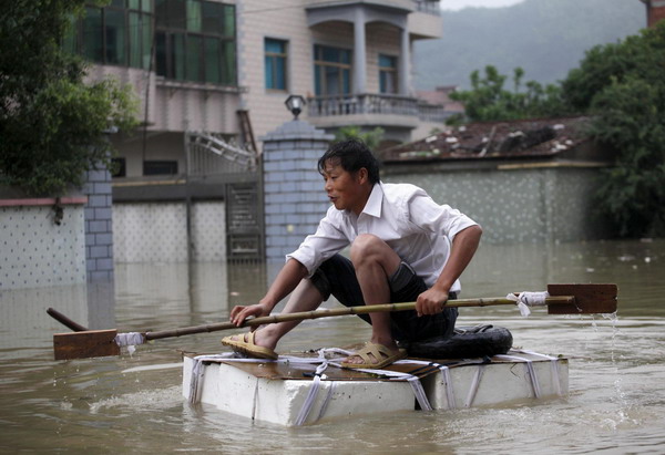 Downpours damage farmland, inflate food prices