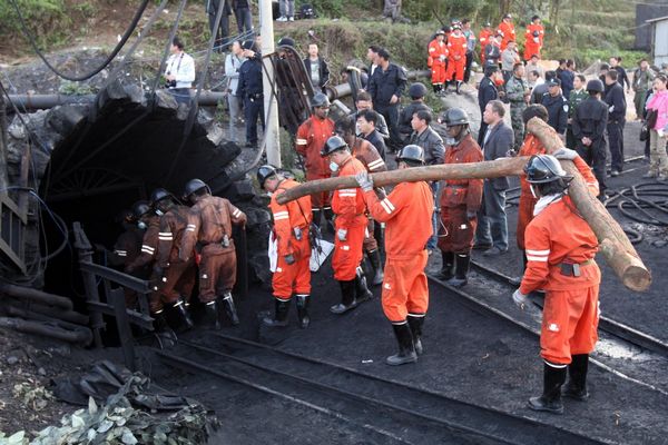 Rescuers rush to save 23 trapped coal miners