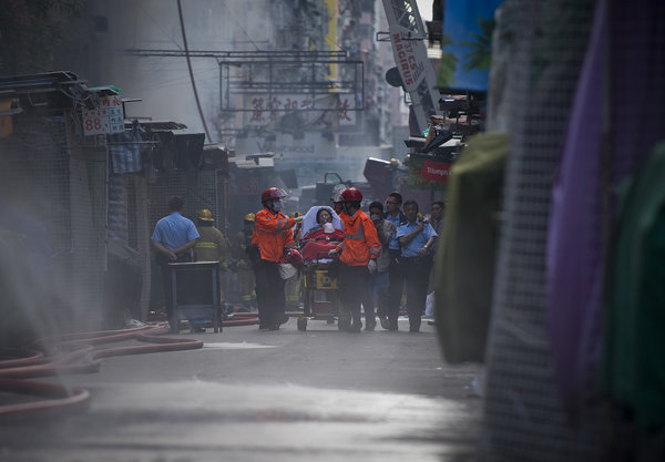 Death toll rises to 9 in HK downtown fire