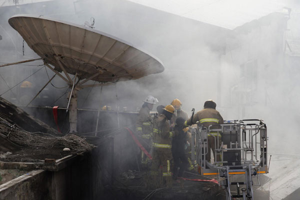Death toll rises to 9 in HK downtown fire
