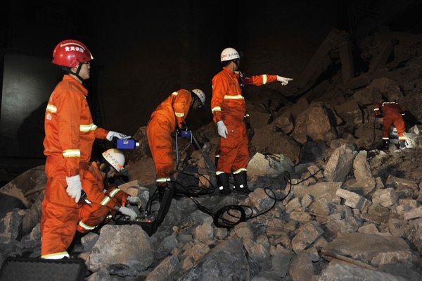 4 dead, 3 remain buried in SW China landslide
