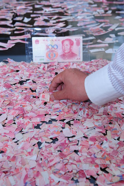 50,000 yuan bank notes torn by psychotic woman