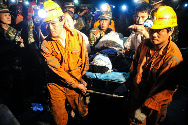 11 workers confirmed alive under flooded mine