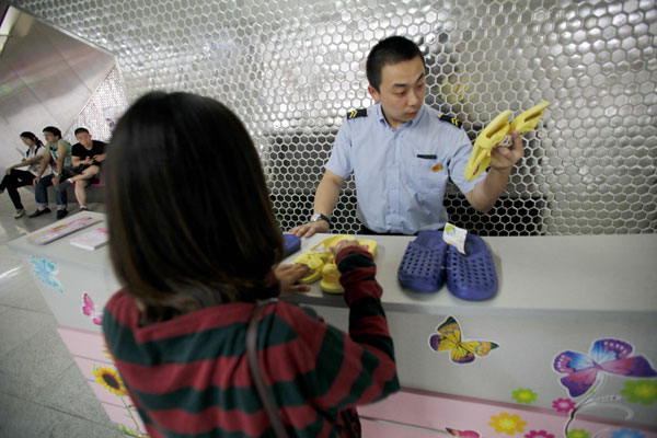 Beijing subways offer replacement slippers