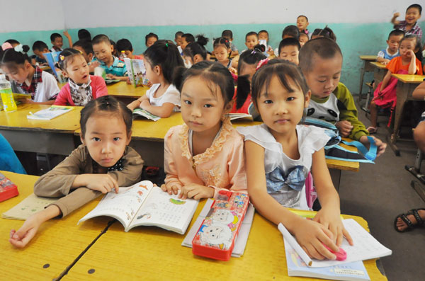 Migrant children to sit <EM>gaokao</EM> in cities