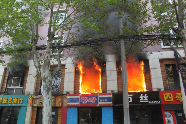 Death toll rises to 14 in central China hotel fire
