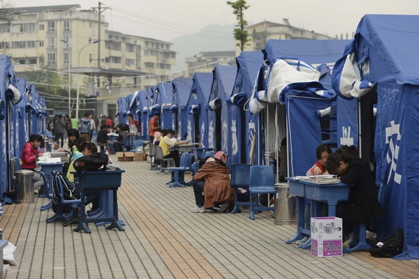 Students continue study in tents after quake