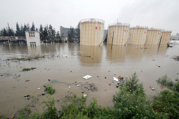 Rainstorm floods chemical storage tanks