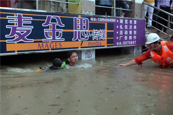 33 dead, 12 missing in S China storms