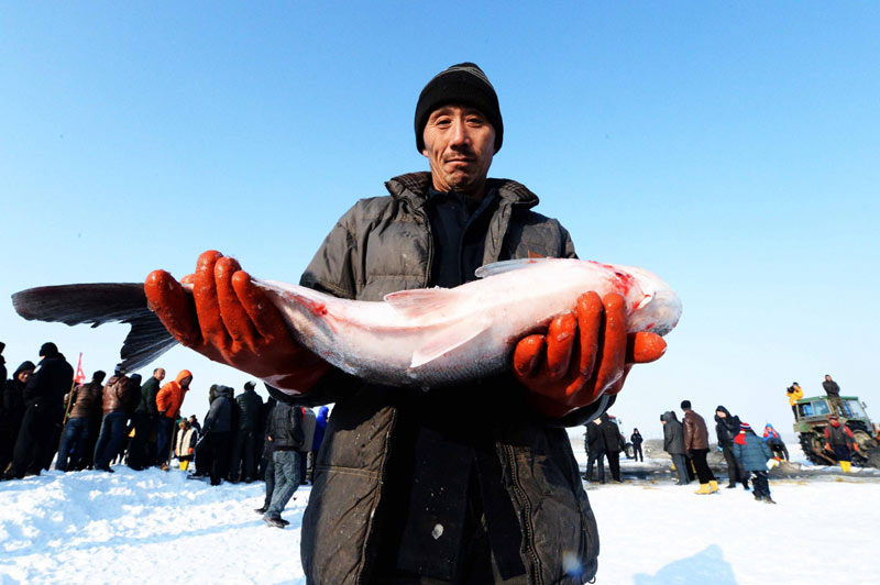 Ancient fishing ritual held on frozen river