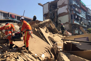 Official commits suicide following building collapse