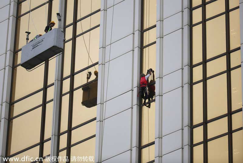 French 'spiderman' scales 33-story building in Macao