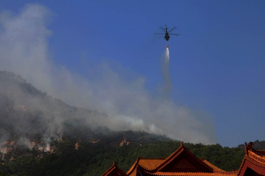 Helicopters sent to quell E China fire