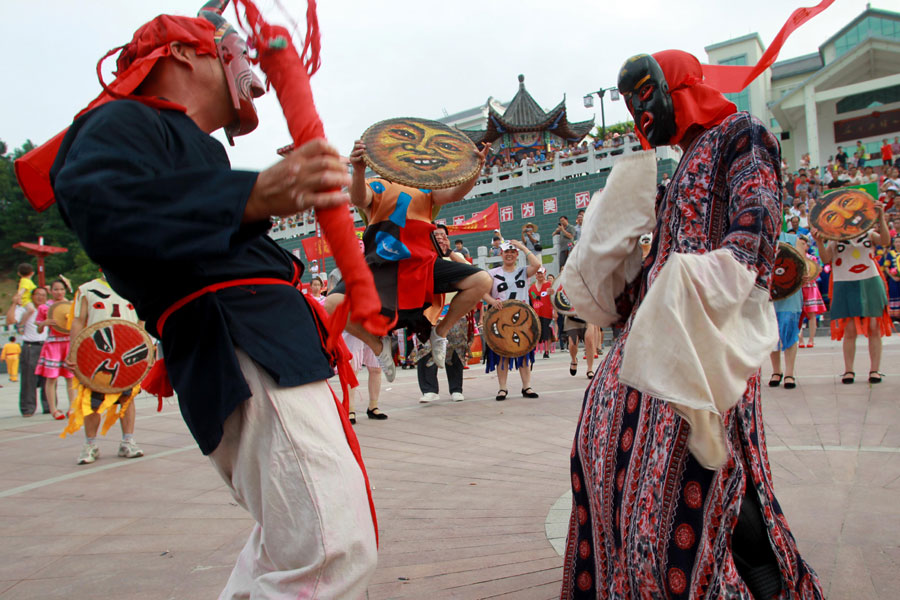 Nuo Dance performed in Fenlong Festival in Hechi, S China