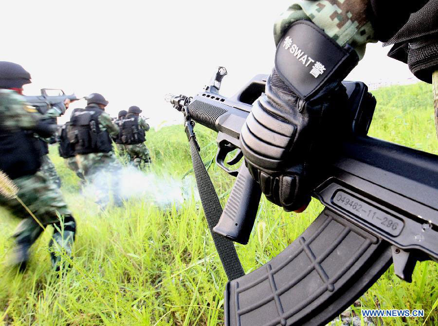 Armed policemen conduct combat exercises in Shanghai