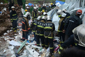 Rescuers save 3 trapped in collapsed building
