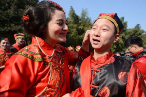 Couples tie the knot in traditional group wedding