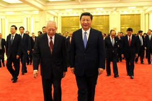 Xi says no wavering in reunification