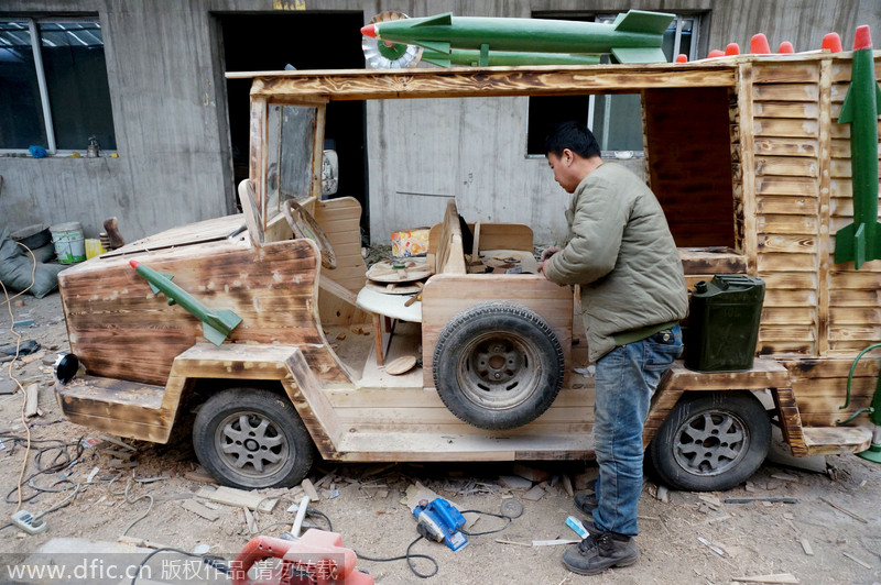 Carpenter carves armored vehicle from wood