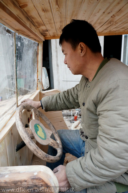 Carpenter carves armored vehicle from wood