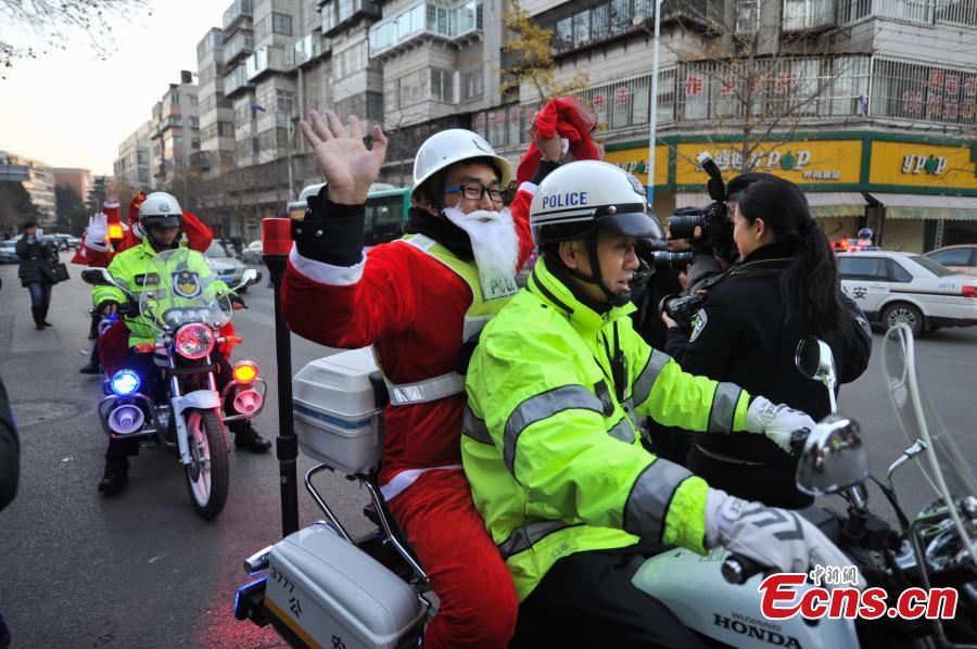 Santa traffic policemen add festivity to the streets