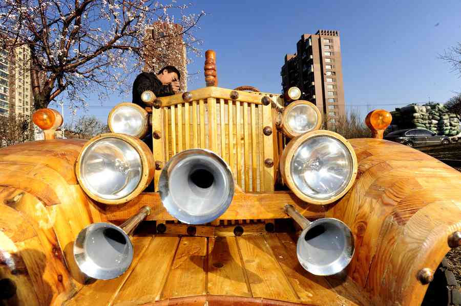 Chinese man makes antique car out of wood