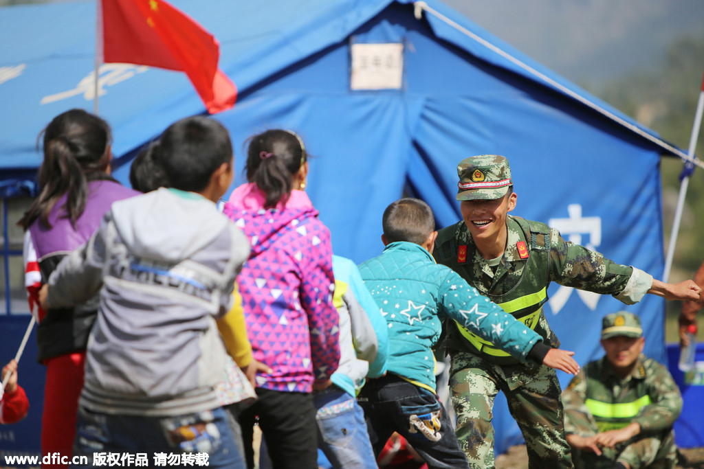 Earthquake relief soldiers have a lighter moment with kids