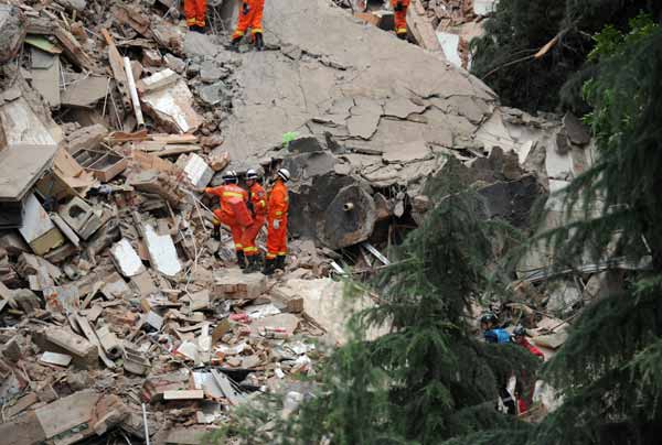 Nine-story building collapses after landslide, 16 missing