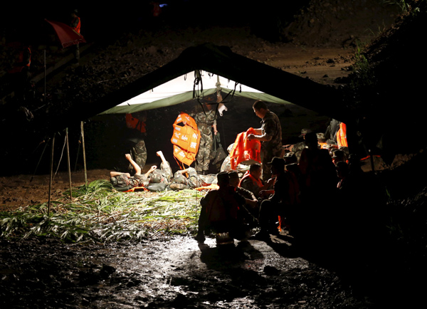 Rescuers fight bad weather at night