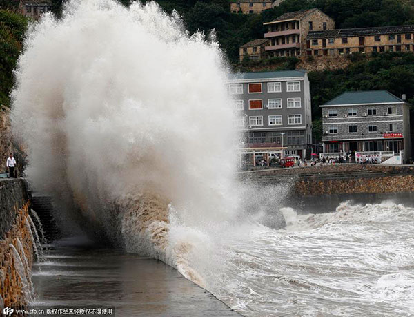 Typhoon Chan-Hom causes flooding, power cuts and panic buying