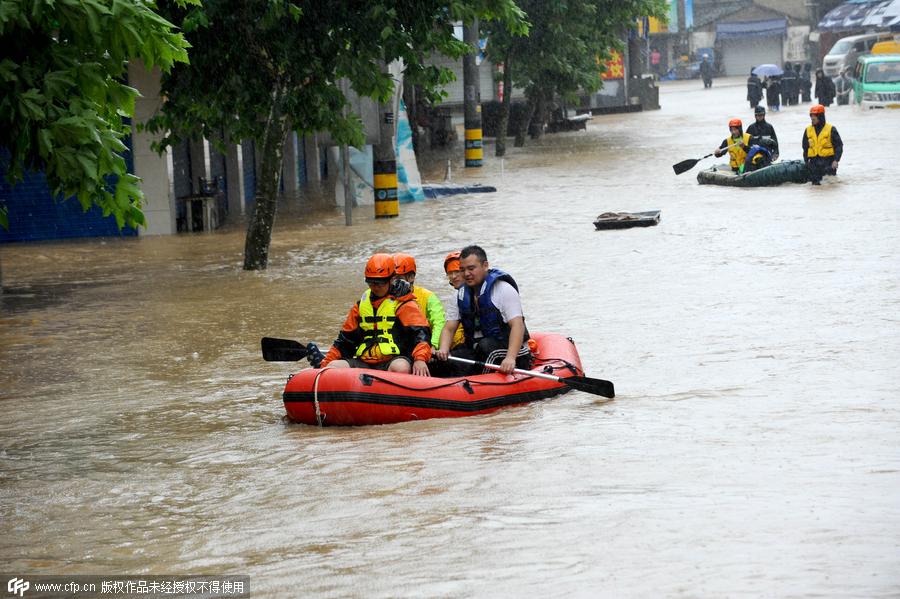 Rescuers help people flee flooding as typhoon hits Zhejiang province