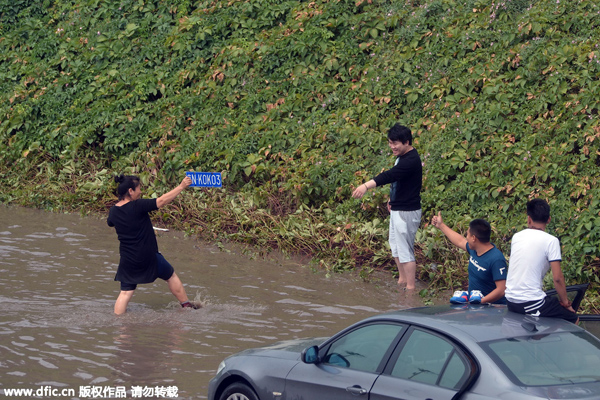 Rains leave Beijing's streets flooded, force evacuation