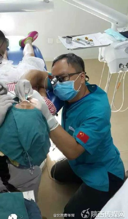 Photo of kneeling dentist performing surgery on child goes viral