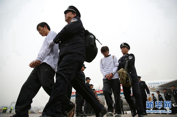 Police extradite phone fraud suspects from Indonesia