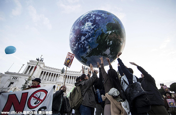 Historic climate pact adopted at COP21, China vows to take obligations