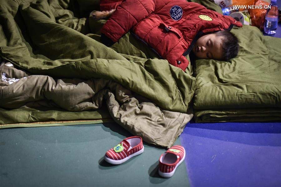 Survivors find temporary home in a shelter after Shenzhen landslide