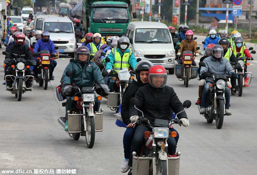 Migrant workers riding motorcycles home for Spring Festival reunion