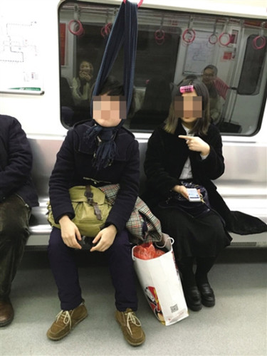 Tired woman ties up head to sleep on subway
