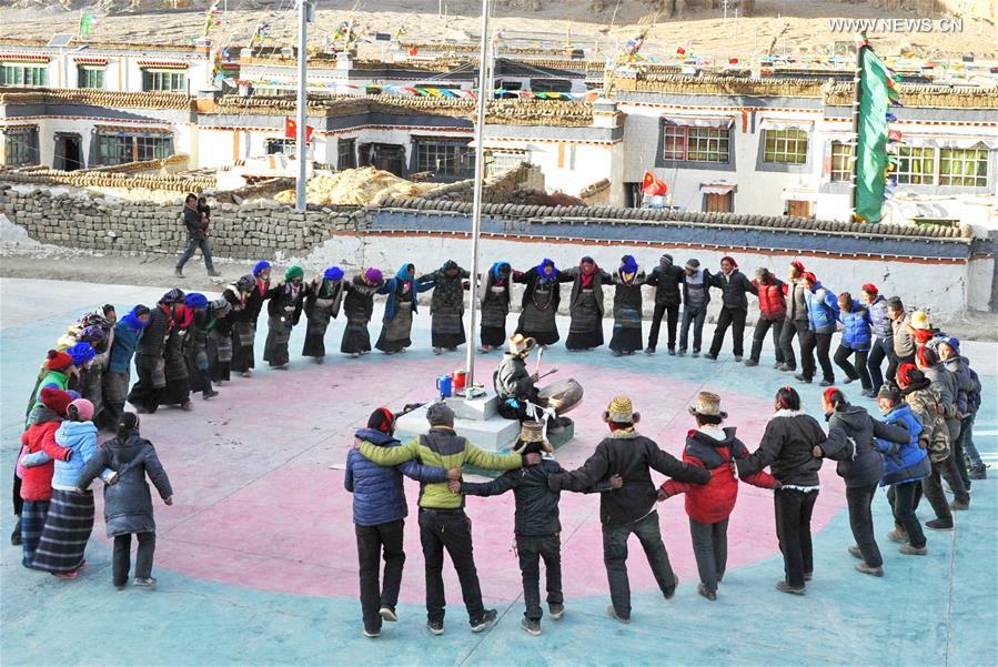 Villagers gather to dance 