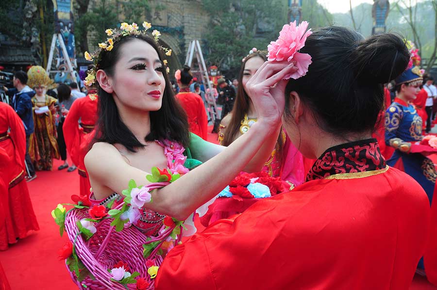 Students in traditional dresses celebrate Women's Day