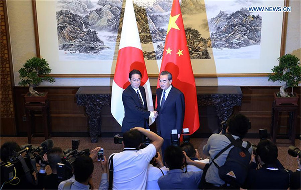 Chinese FM makes requirements on improving China-Japan ties