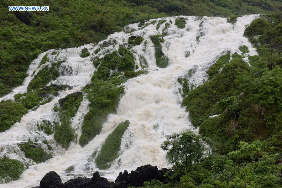 torrential,richter scale torrential rainfall triggers flash flood in china