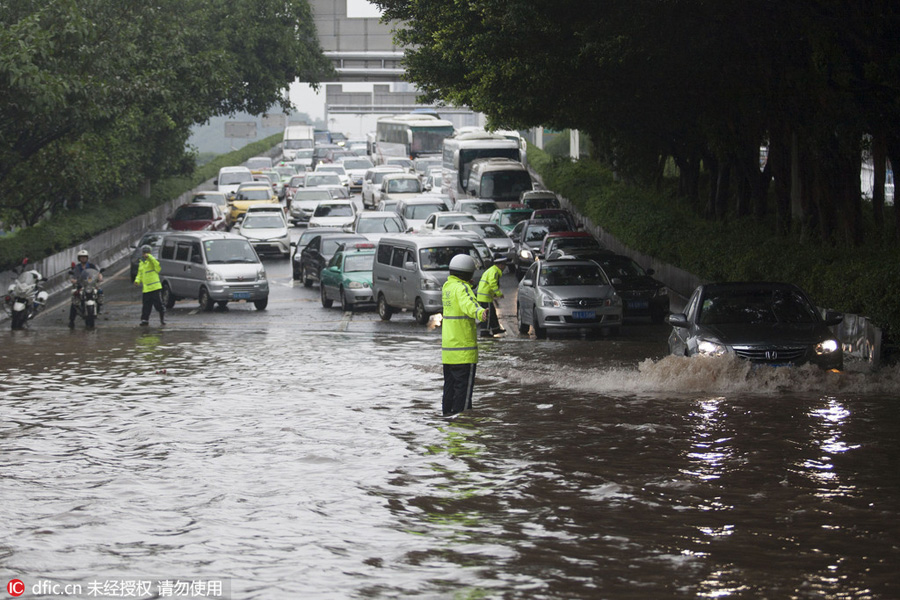 heavy rains flood streets in guangzhou