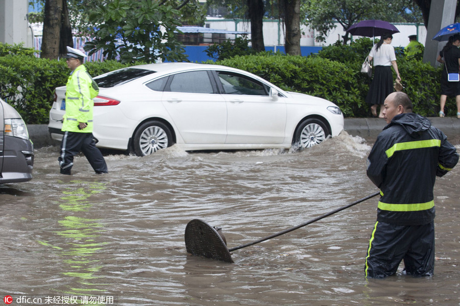 Heavy rains flood streets in Guangzhou